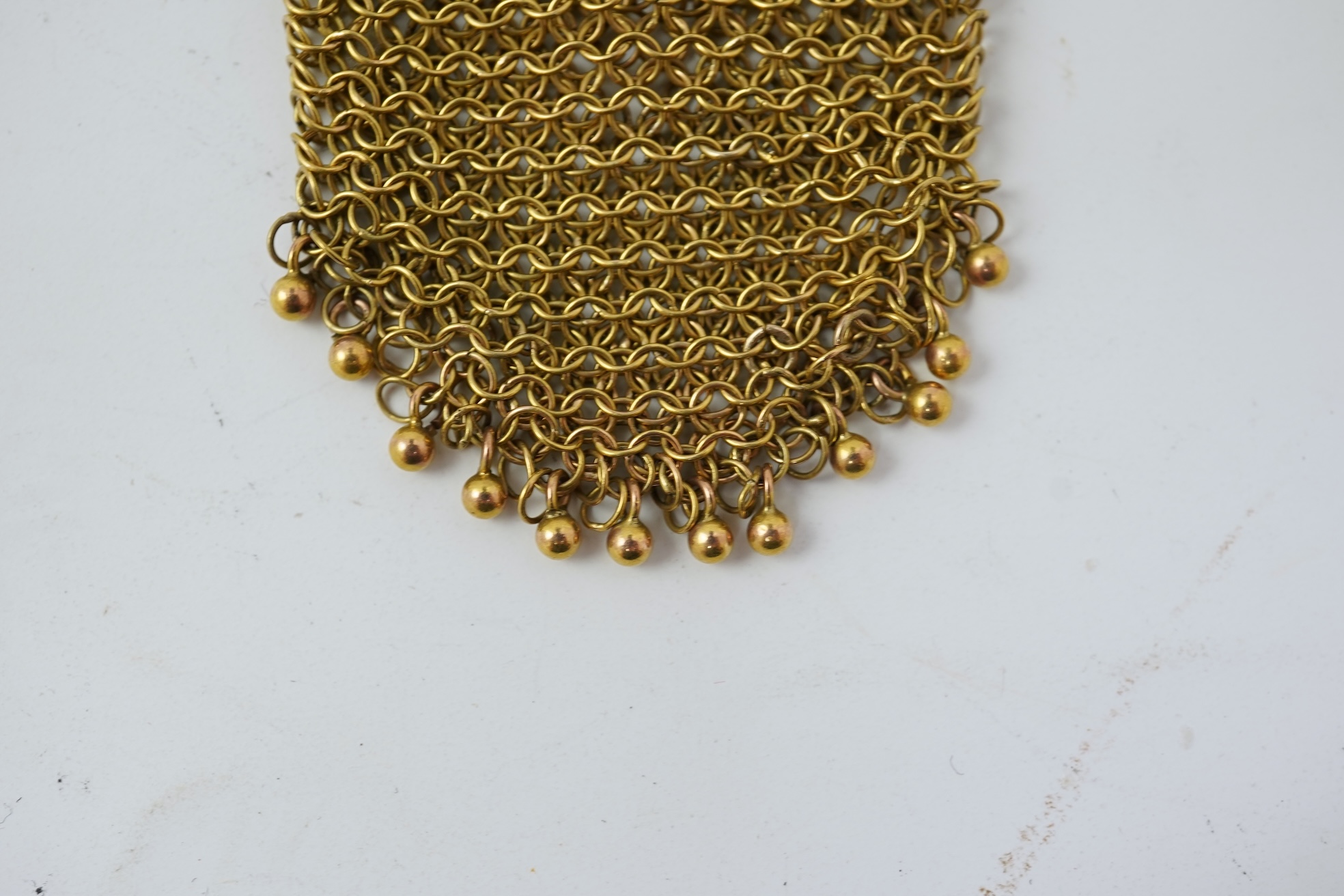 A small early 20th century 9ct gold mesh purse